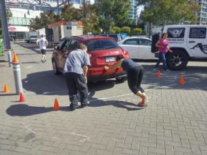 Pushing a car at the end of the obstacle course event